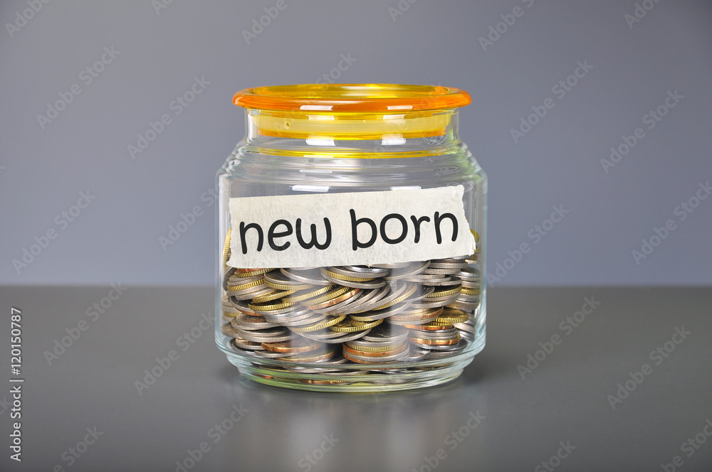 Saving concept of coins in the glass jar for new born  purpose