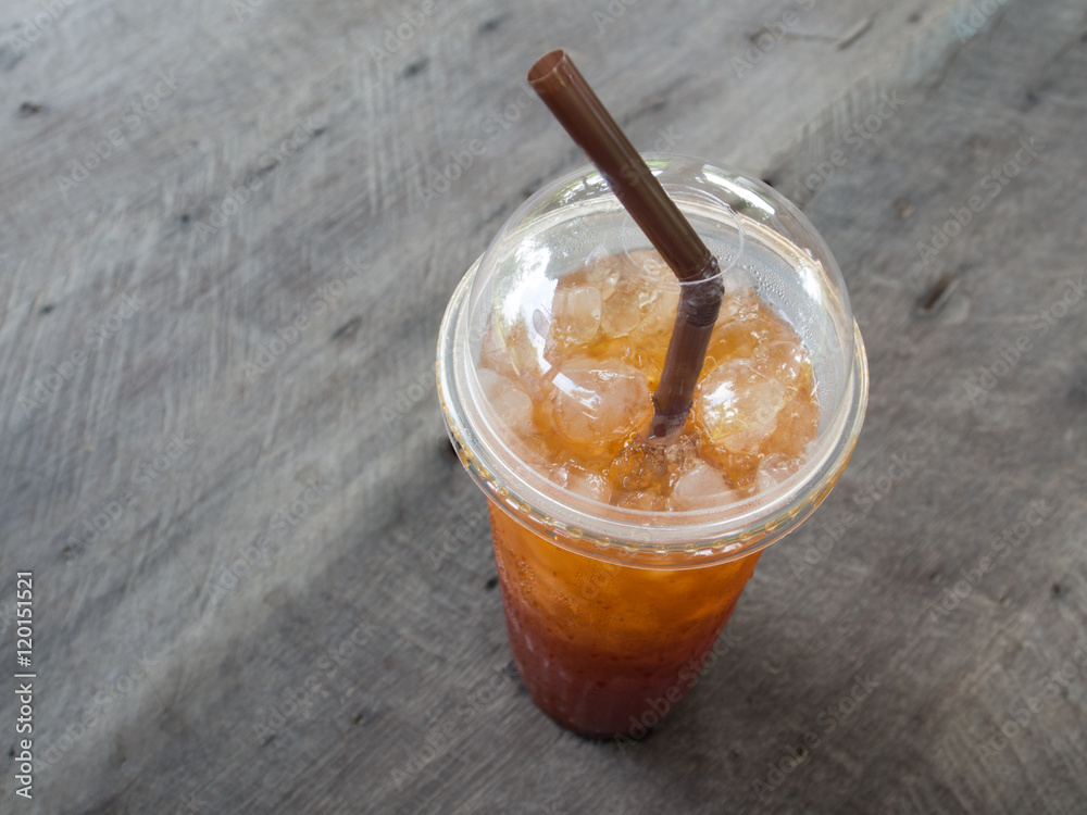 Soft drink in glass on wooden table Soft drink in glass on wooden table