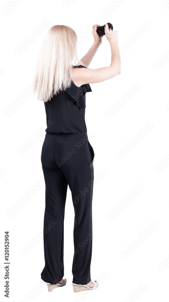 Back view of woman photographing. girl photographer in jeans. Rear view people collection. backside view of person. Isolated over white background. Back view of woman photographing. girl photographer in jeans. Rear view people collection. backside view of person. Isolated over white background.