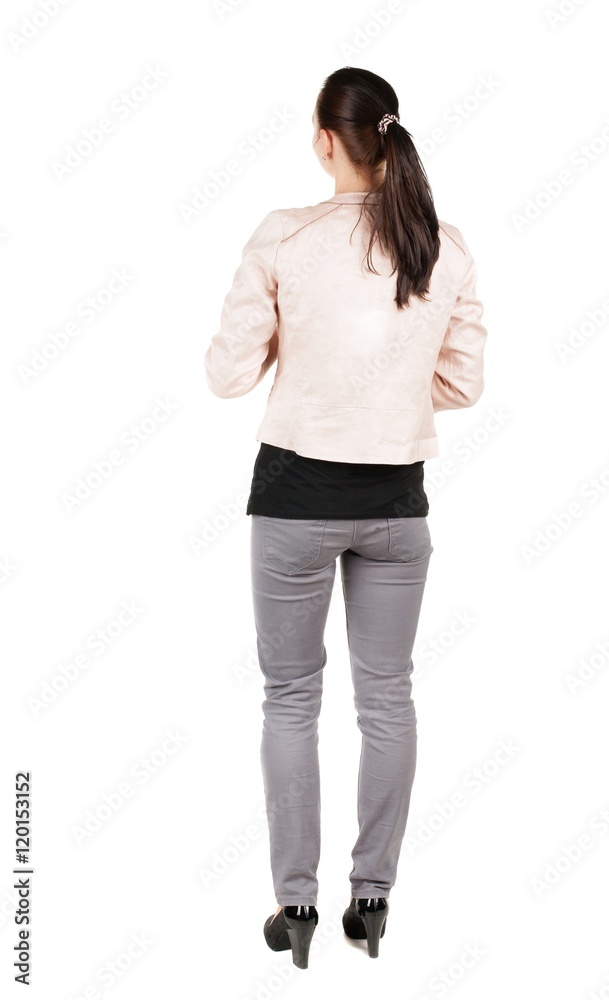 back view of standing young beautiful brunette woman. girl watching. Rear view people collection. backside view of person. Isolated over white background. back view of standing young beautiful brunette woman. girl watching. Rear view people collection. backside view of person. Isolated over white background.
