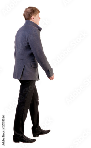 Back view of going young business man in gray coat. walking young businessman . Rear view people collection. backside view of person. Isolated over white background.