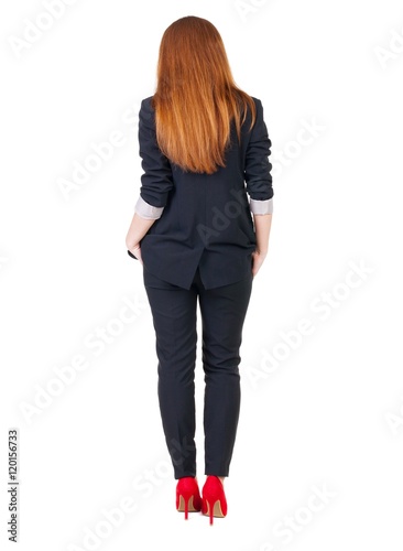 back view of redhead business woman contemplating. Young girl in suit. Rear view people collection. backside view of person. Isolated over white background.