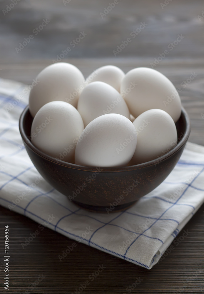 Fresh chicken eggs in bowl on a table. Fresh chicken eggs in bowl on a table.