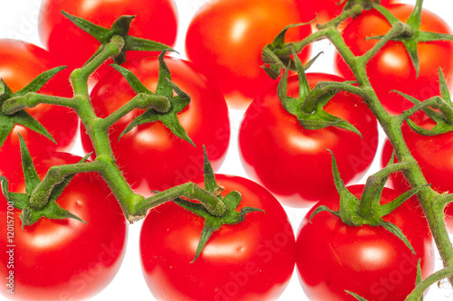 Cherry tomatoes isolated over white background