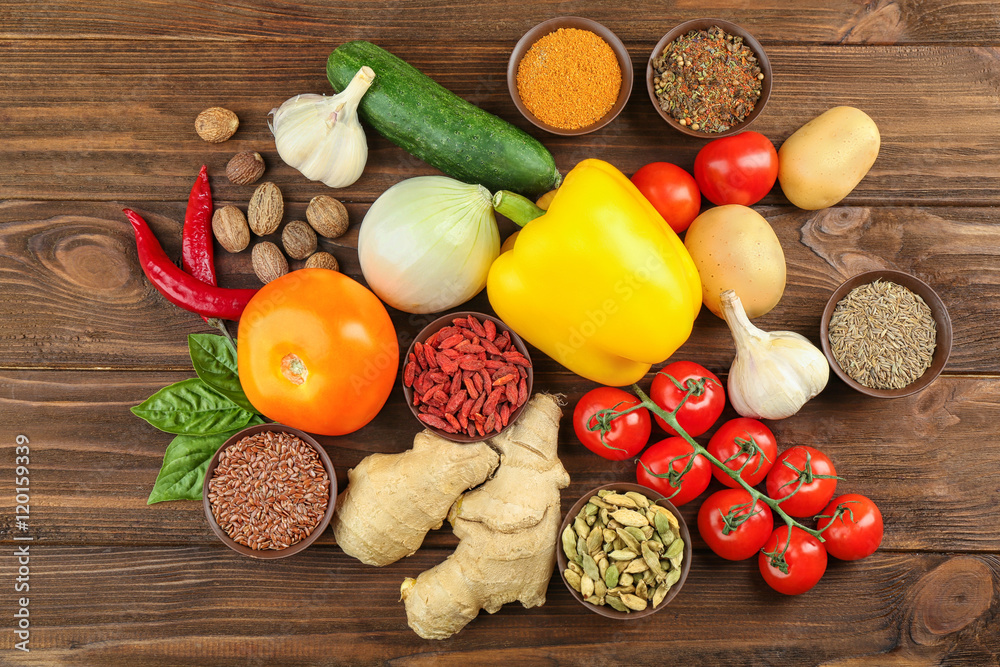 Vegetables and spices on wooden table Vegetables and spices on wooden table