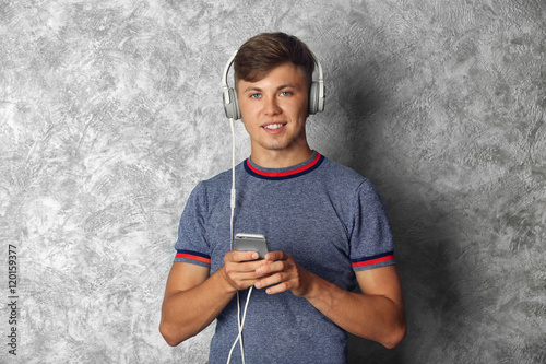 Handsome guy listening musi...
