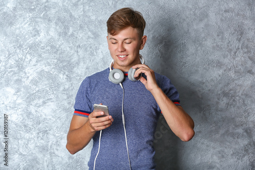 Handsome guy listening musi...