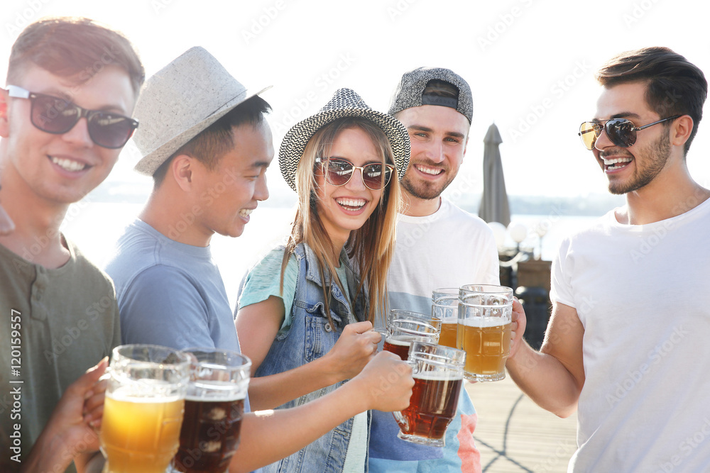 Group of friends hanging out together outdoors Group of friends hanging out together outdoors