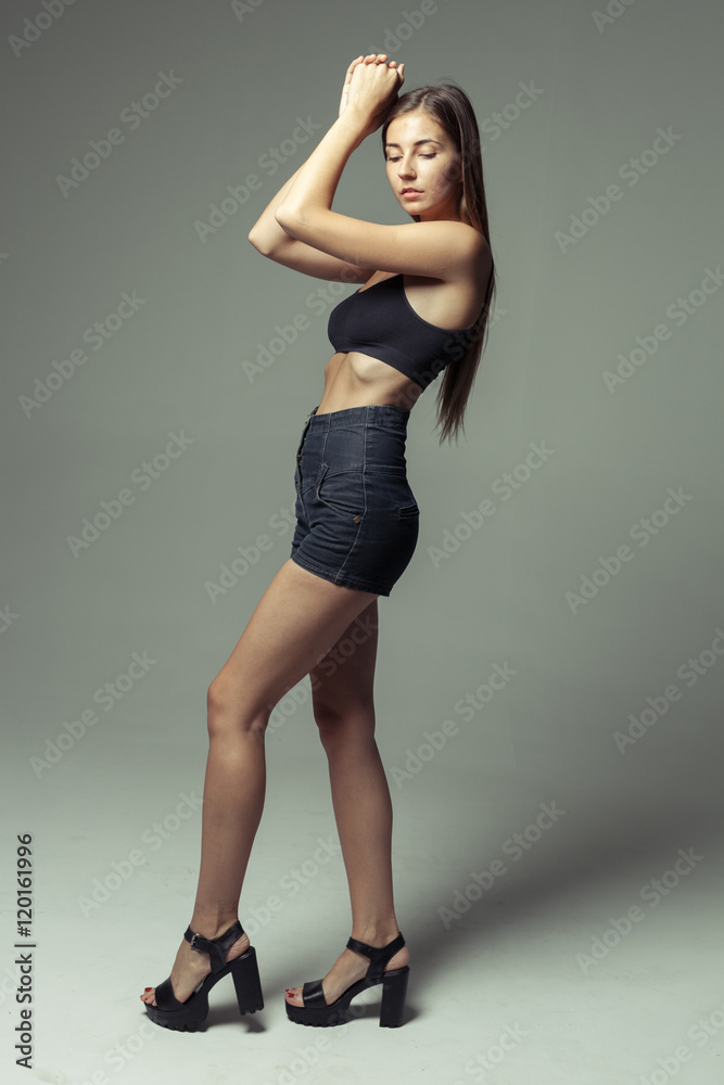 model tests of young pretty girl over grey background model tests of young pretty girl over grey background