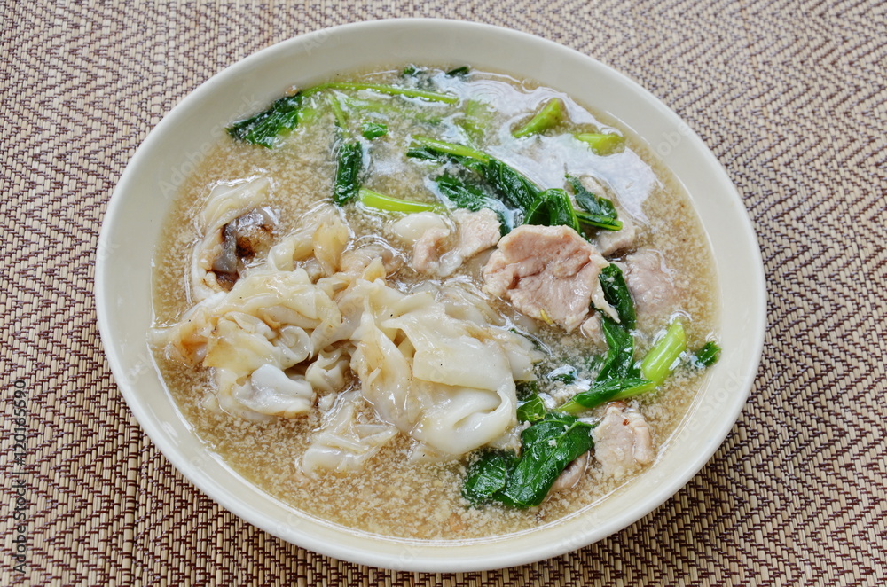 stir fried rice noodle with pork in gravy sauce on dish stir fried rice noodle with pork in gravy sauce on dish