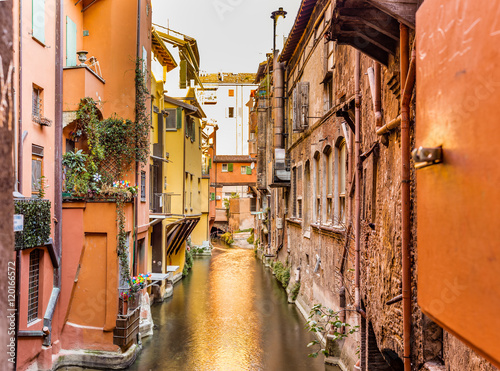 water canal hidden behind a window in Italy