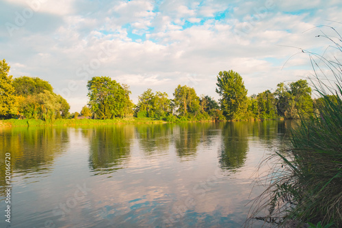 Fototapeta Naklejka Na Ścianę i Meble -  Quiet river trees and clouds