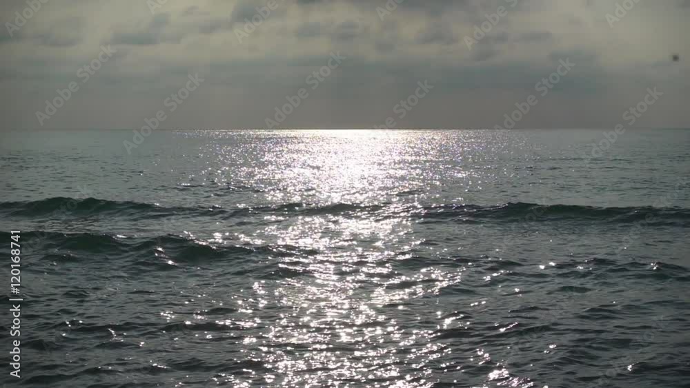 Sun Sparkles on Rippling Sea Waves at Noon. Slow motion Sun Sparkles on Rippling Sea Waves at Noon. Slow motion