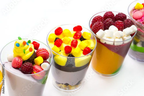 dessert in plastic cups cream with fruit and pastries and mousse