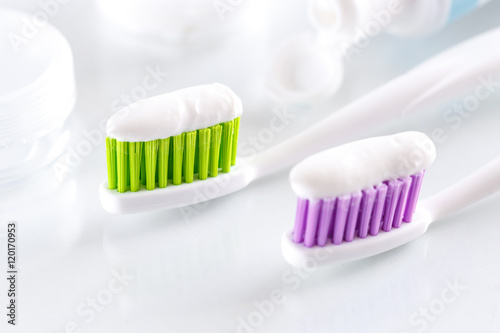 sqweezed toothbrushes on white background