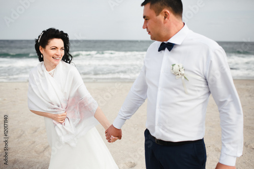 Happy married couple on the shore