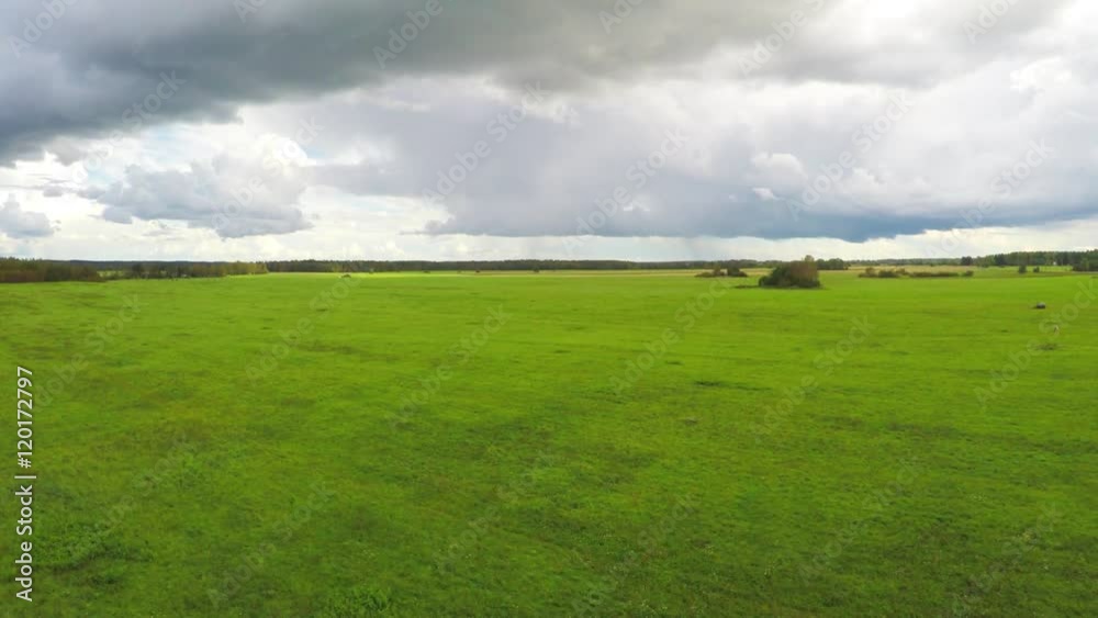 Aerial view of countryside and farmland in summer. Green fields. Aerial view of countryside and farmland in summer. Green fields.