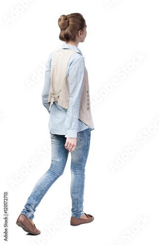 back view of walking  woman in vest. beautiful girl in motion.  backside view of person.  Rear view people collection. Isolated over white background. Girl with a bun of hair left out