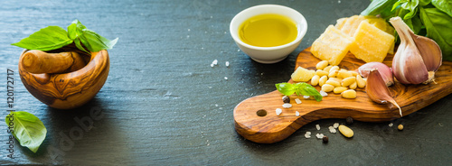 Pesto sauceingredients on wood board photo