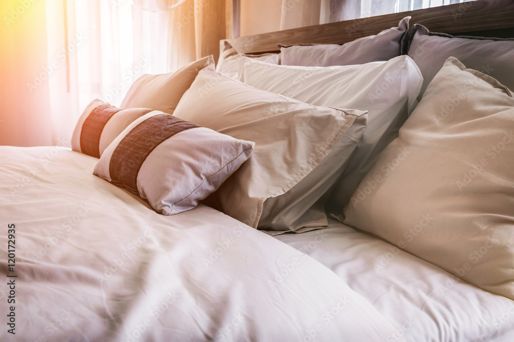 Bed maid-up with clean white pillows and bed sheets Bed maid-up with clean white pillows and bed sheets