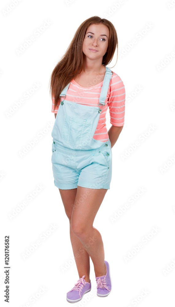 Red-haired teen girl in shorts. isolated on white background Red-haired teen girl in shorts. isolated on white background