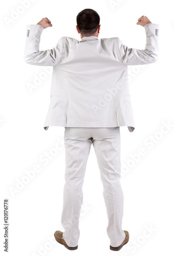 Businessman thumbs up. rear view. Isolated over white 