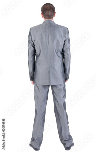 Businessman looks ahead. rear view. Isolated over white 