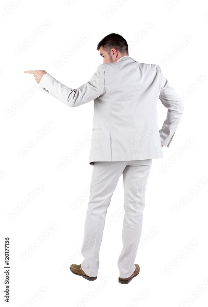 Businessman pointing at wall. rear view. Isolated over white . Businessman pointing at wall. rear view. Isolated over white .
