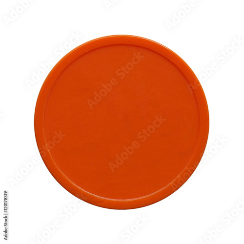 Orange plastic chip fiche token money used to buy food and drink during event or festival - isolated over white photo