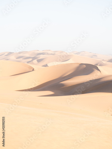 Dunes on the Namib Desert close to Sandwich Harbour in bright afternoon sunlight.