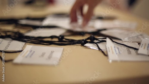 People take badges before the conference
