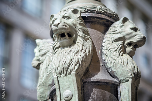 Sculpture of lions buttress fonanry pole on the Ilinka street in Moscow photo