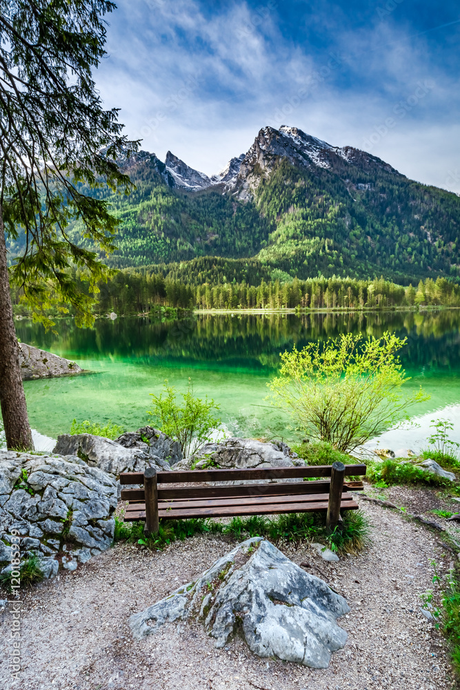 Wooden bench at the Hitersee lake in the Alps, Germany Wooden bench at the Hitersee lake in the Alps, Germany