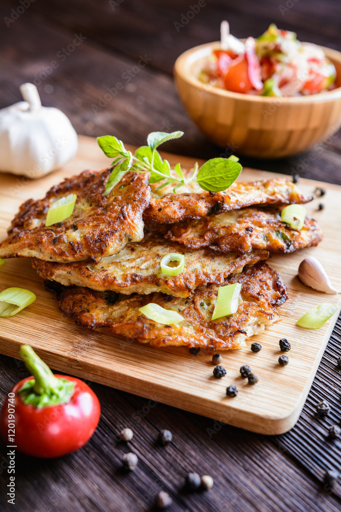 Fried celery pancakes with vegetable salad