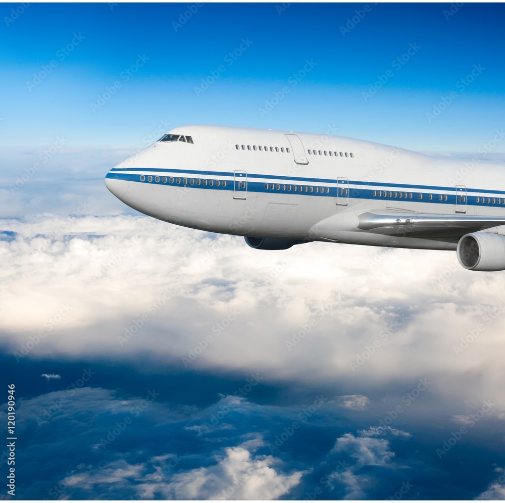 Fototapeta premium passenger airplane in the clouds. travel by air transport. flying to the top of the airliner. nobody