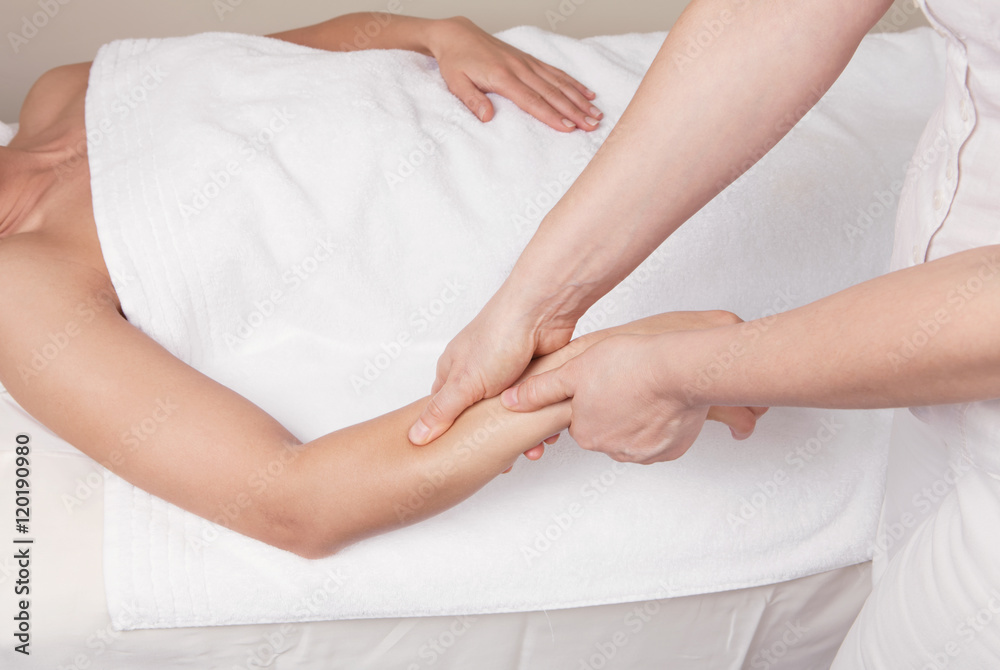 A qualified therapist doing a pressure point massage to relax a A qualified therapist doing a pressure point massage to relax a
