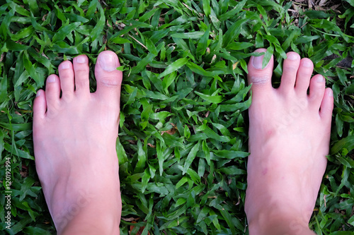 feet on grass background