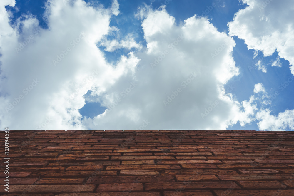 clouds in the blue sky over a roof of the building clouds in the blue sky over a roof of the building