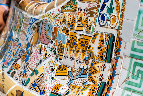 Fragment of a colorful ceramic bench at Parc Guell. Barcelona