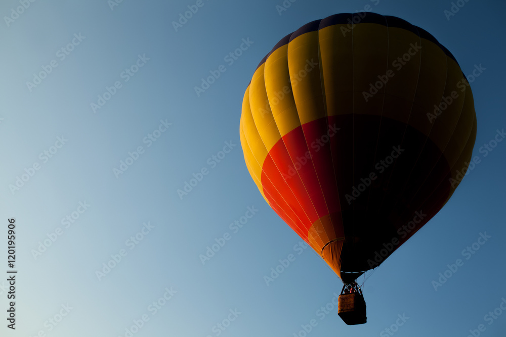 Fototapeta premium air balloon flying in clear blue sky;