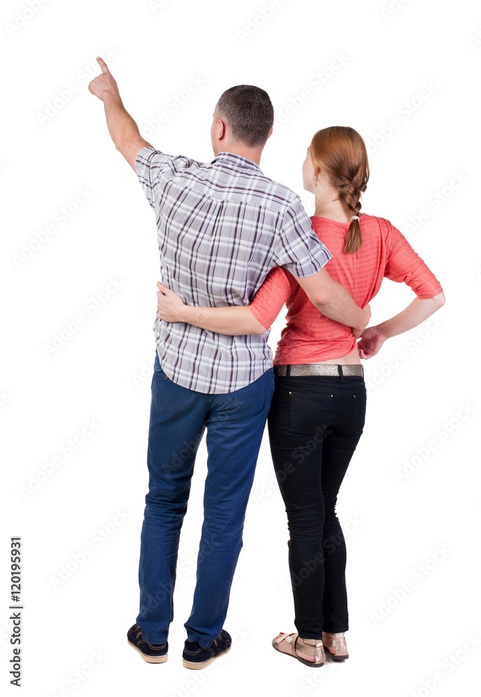 Fototapeta premium young couple pointing. Back view. Rear view people collection. backside view of person. Isolated over white background.