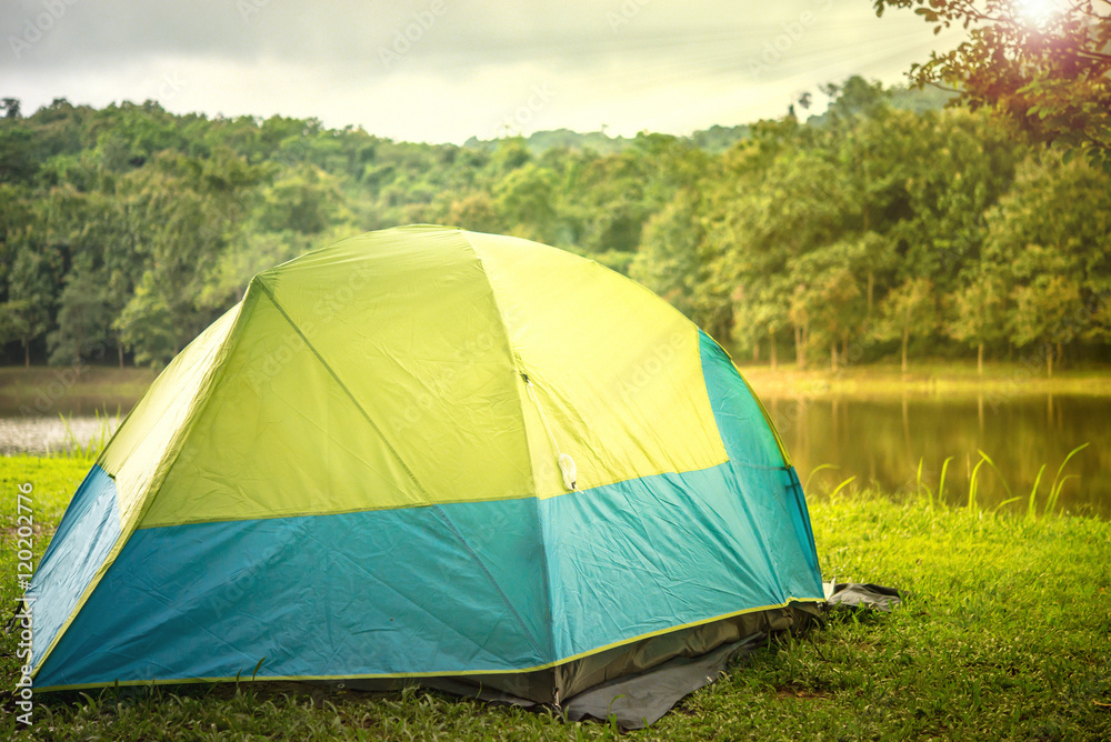Tourist tent camping with sunshine in wilderness