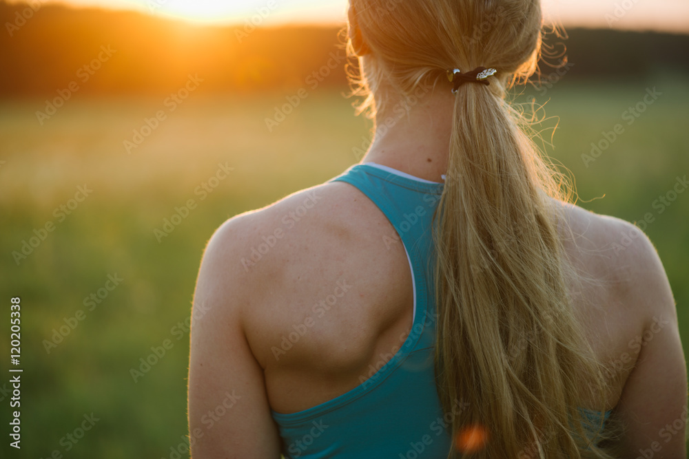 Close up sports woman image. Back view. Close up sports woman image. Back view.