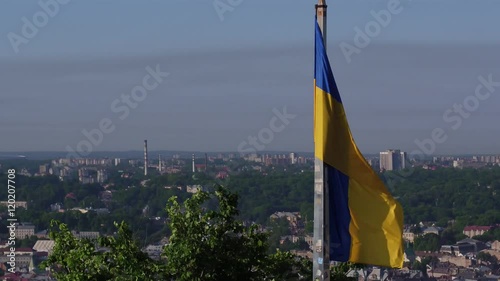 Ukrainian Flag Flying on Top of the Beautiful Panorama of the City Lviv.Aerial Shot in Lviv photo