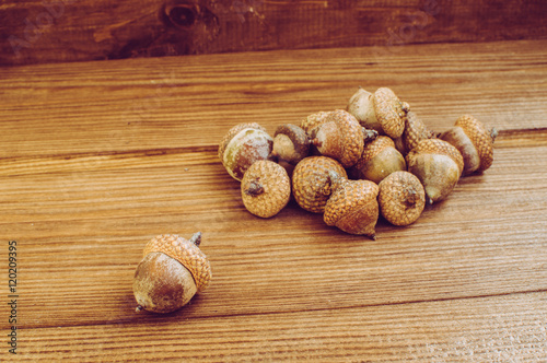 Some acorns on the wooden table