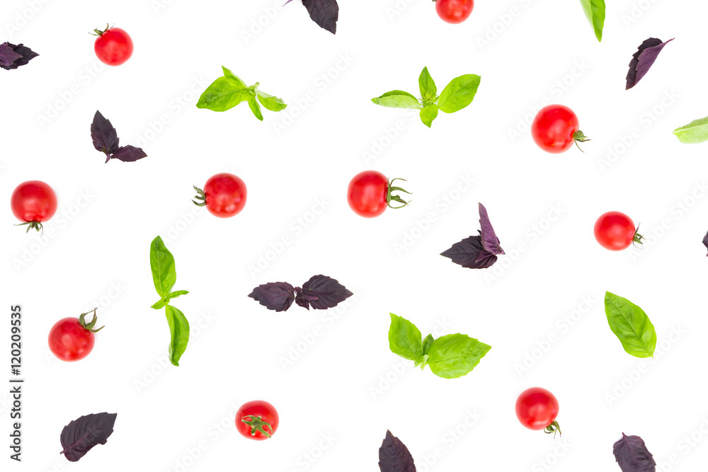Colorful pattern made of cherry tomatoes, purple and green basil on white background. Cooking concept. Colorful pattern made of cherry tomatoes, purple and green basil on white background. Cooking concept.