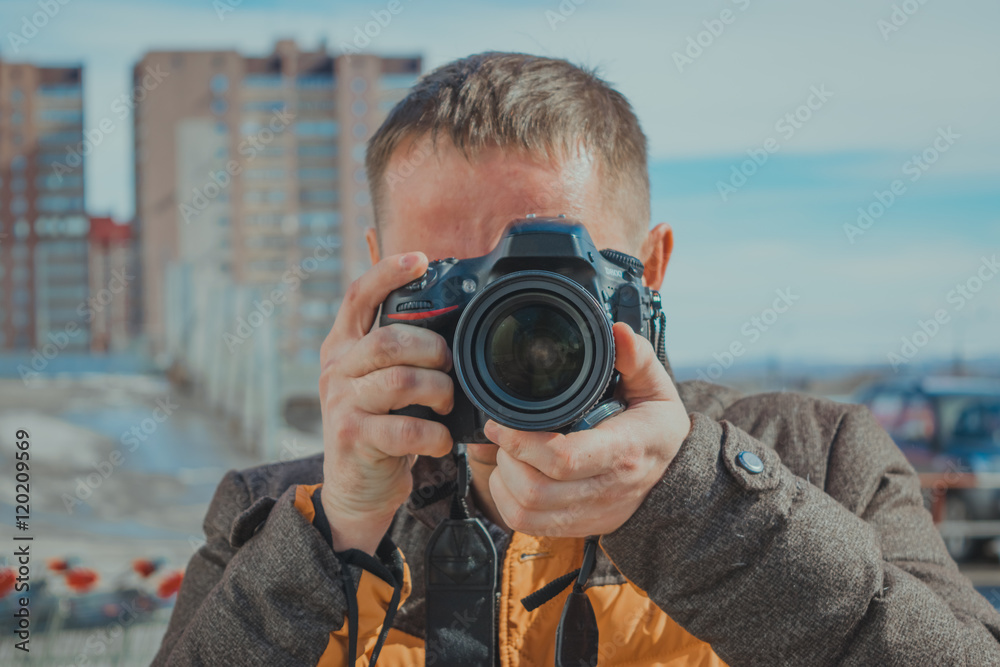Young man with a camera Young man with a camera