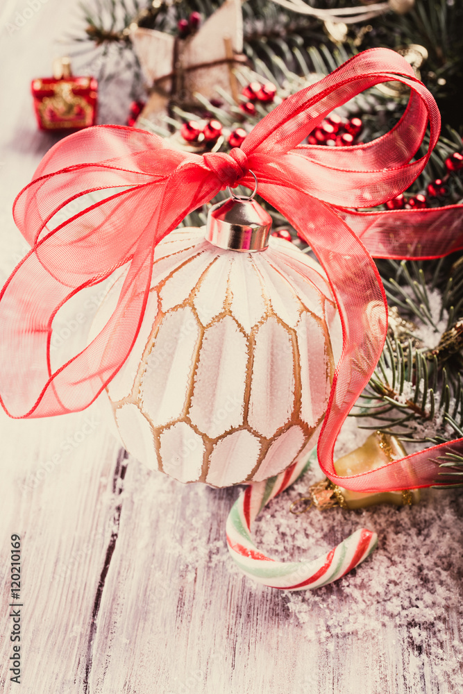 Colorful Christmas ball and decoration with christmas tree on old wooden background. Winter holiday concept with copy space. Retro style toned.