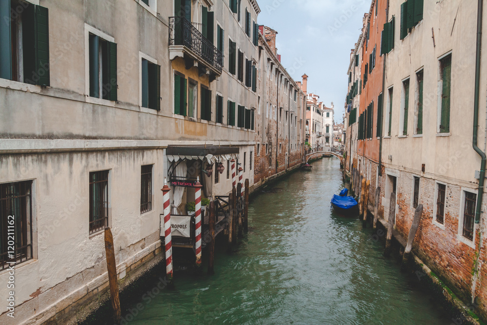 Canal, boat and houses in Venice