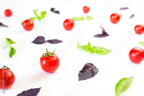 Wallpaper Mural Colorful pattern made of cherry tomatoes, purple and green basil on white background. Cooking concept. Torontodigital.ca